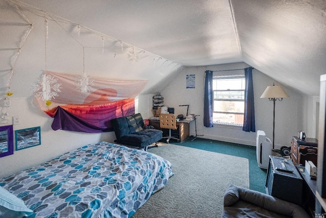 carpeted bedroom with a textured ceiling and vaulted ceiling