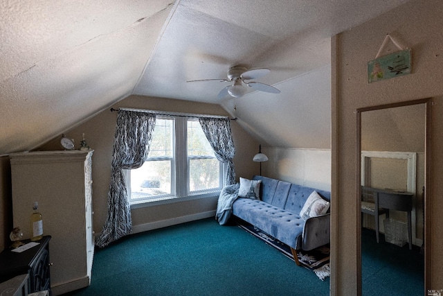 bedroom with ceiling fan, dark colored carpet, vaulted ceiling, and a textured ceiling