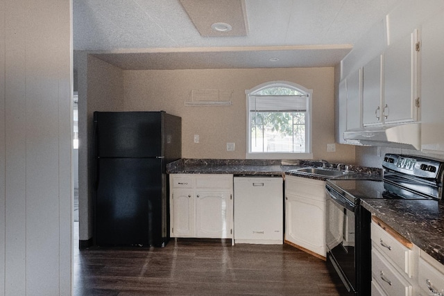 kitchen featuring black appliances, sink, dark stone countertops, white cabinets, and dark hardwood / wood-style flooring