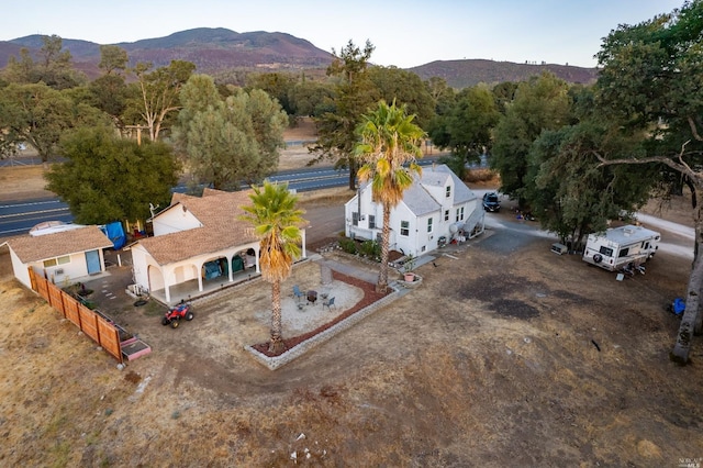 birds eye view of property featuring a mountain view