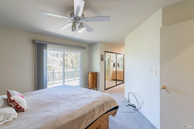 carpeted bedroom featuring a closet, ceiling fan, access to exterior, and a textured ceiling