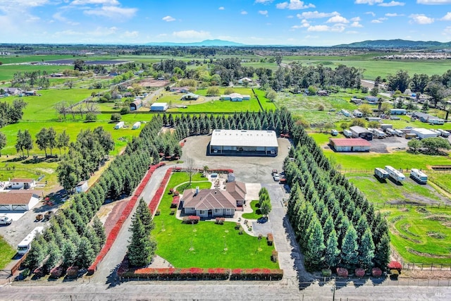 birds eye view of property featuring a mountain view and a rural view