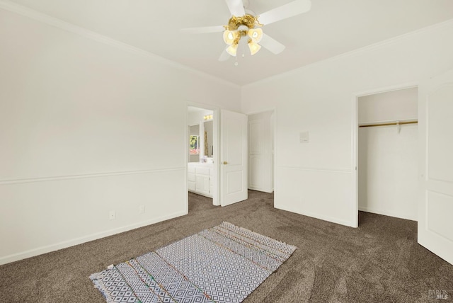 bedroom with dark carpet, ornamental molding, ceiling fan, connected bathroom, and a closet