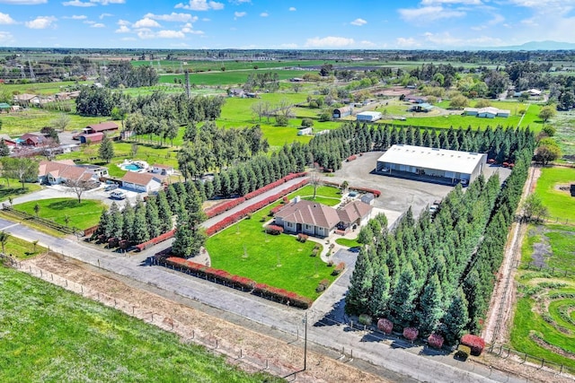 birds eye view of property with a rural view