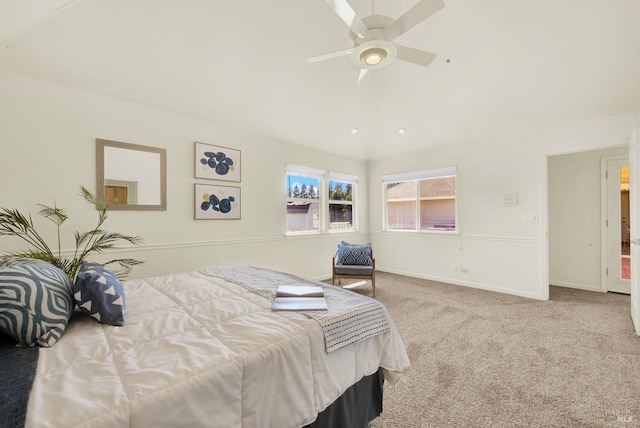 carpeted bedroom with a ceiling fan, baseboards, and vaulted ceiling