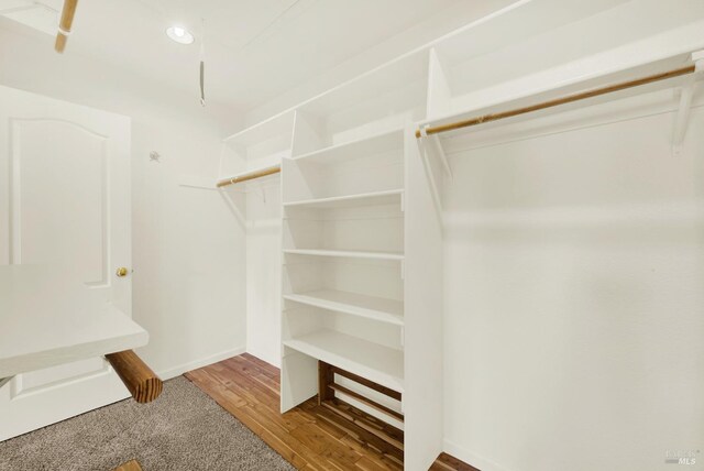 spacious closet with wood finished floors