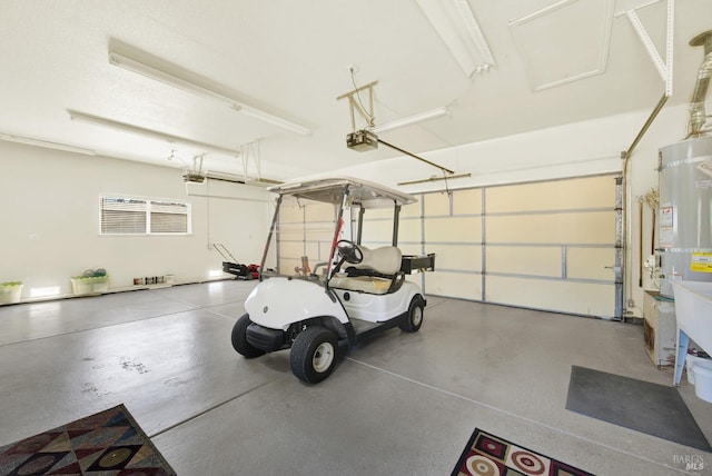 garage with a garage door opener and water heater
