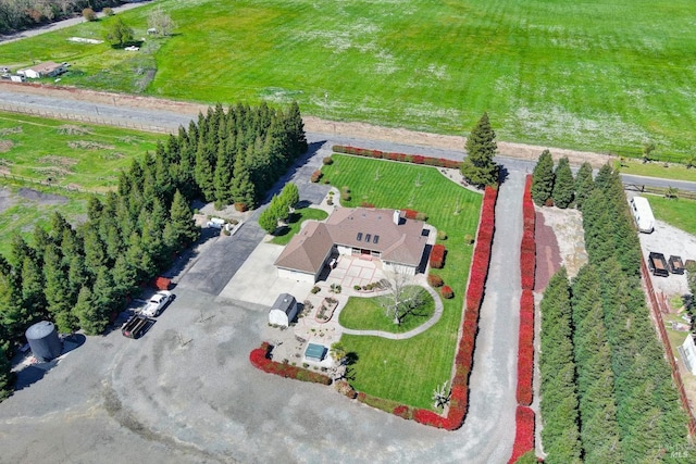birds eye view of property with a rural view
