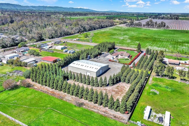 birds eye view of property featuring a mountain view and a rural view