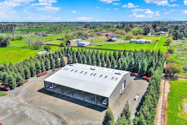 birds eye view of property featuring a rural view
