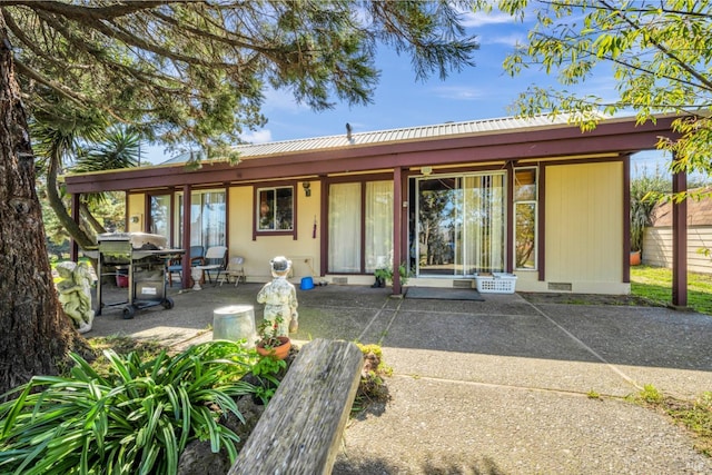 exterior space with a patio area