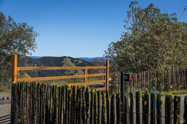 view of gate with a mountain view