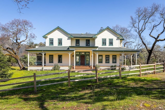 country-style home with a porch and a front lawn