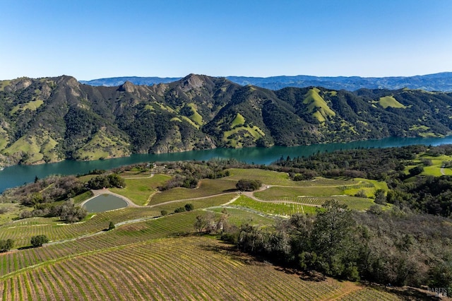 view of mountain feature with a rural view and a water view