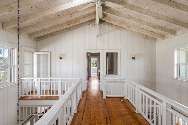 hallway with vaulted ceiling with beams, dark wood-type flooring, and wood ceiling