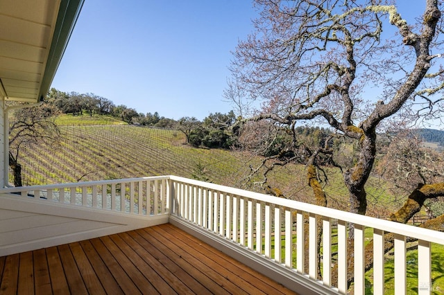 wooden deck with a rural view