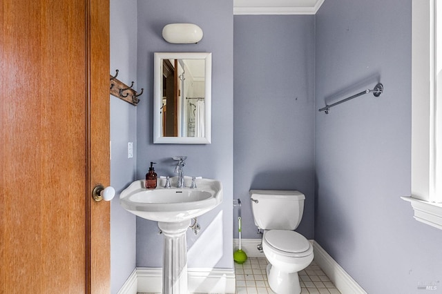 bathroom featuring toilet and tile floors