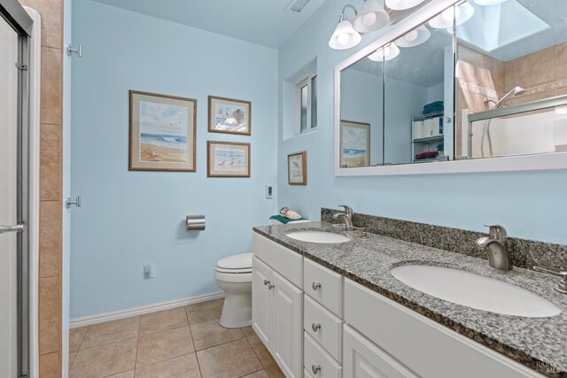201 Pine Ridge Rd, Ukiah, CA 95482 - bathroom with a skylight, a shower stall, a sink, and tile patterned flooring