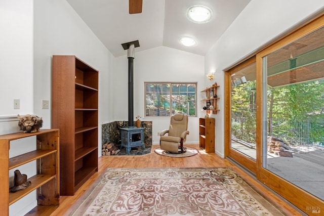 201 Pine Ridge Rd, Ukiah, CA 95482 - living area featuring vaulted ceiling, a wood stove, and wood finished floors