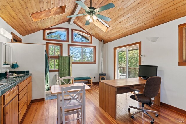 201 Pine Ridge Rd, Ukiah, CA 95482 - office with ceiling fan, vaulted ceiling with skylight, light wood-style flooring, baseboards, and wooden ceiling