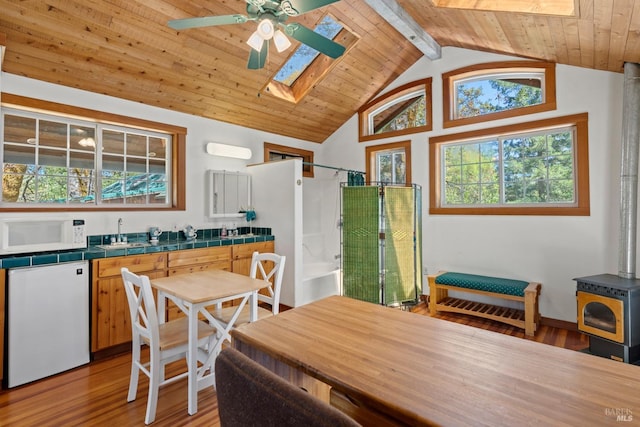201 Pine Ridge Rd, Ukiah, CA 95482 - dining room featuring a ceiling fan, wooden ceiling, lofted ceiling with skylight, and light wood-style floors