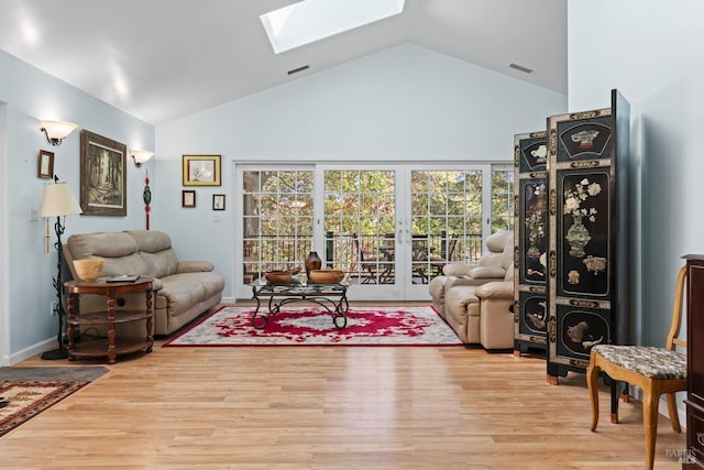 201 Pine Ridge Rd, Ukiah, CA 95482 - living area with french doors, visible vents, a skylight, wood finished floors, and high vaulted ceiling