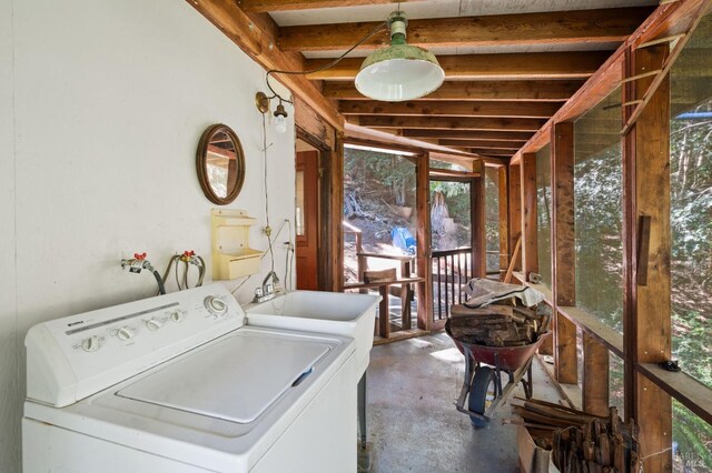 washroom featuring washer / clothes dryer and sink