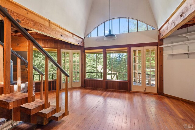 unfurnished sunroom with french doors and vaulted ceiling