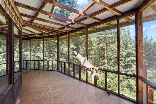 unfurnished sunroom featuring a skylight and coffered ceiling