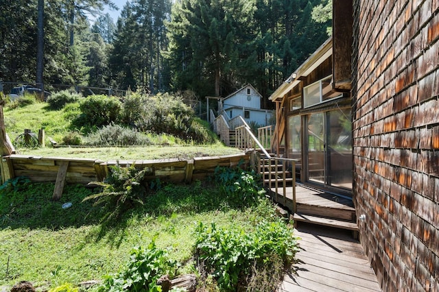 wooden deck featuring a sunroom