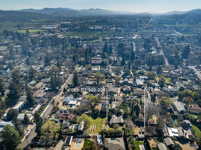 birds eye view of property featuring a residential view and a mountain view