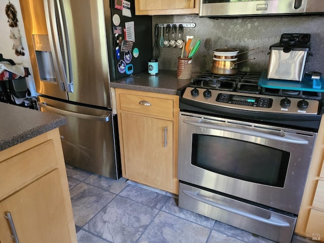 kitchen featuring light brown cabinetry, light tile patterned floors, appliances with stainless steel finishes, and tasteful backsplash