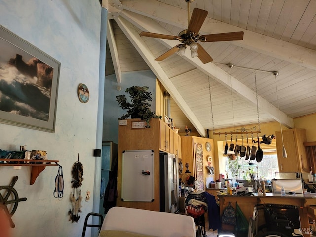 kitchen with ceiling fan, lofted ceiling with beams, and stainless steel fridge