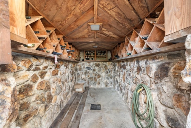 wine area with wood ceiling and vaulted ceiling