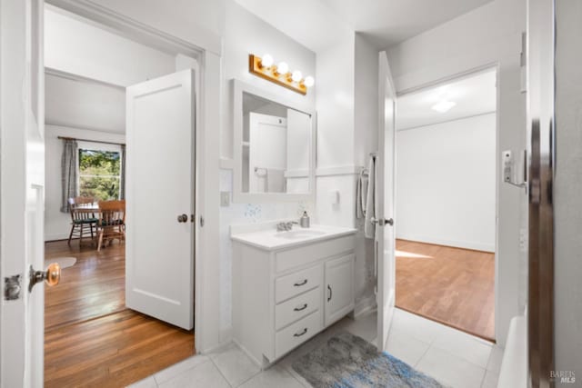 bathroom featuring tile patterned flooring and vanity