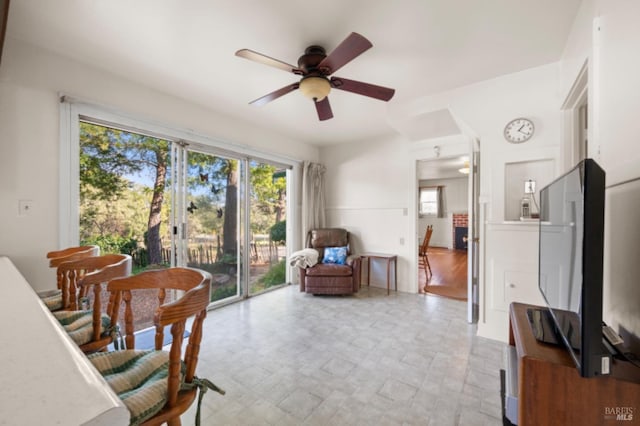 sitting room featuring ceiling fan