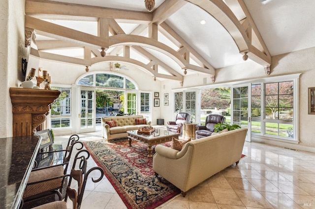 sunroom with vaulted ceiling with beams