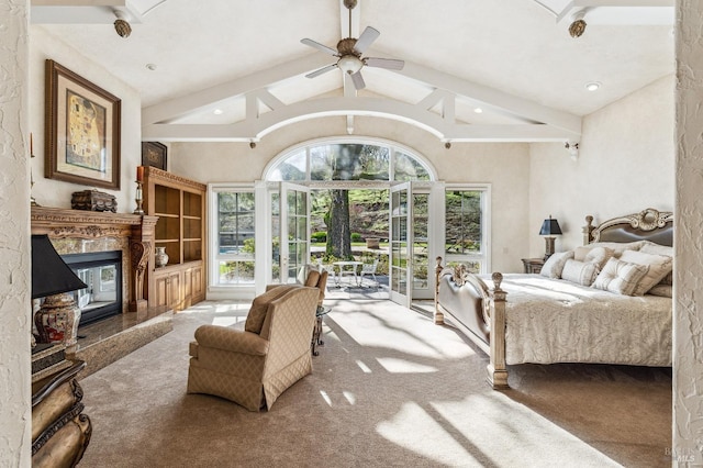 bedroom with access to outside, high vaulted ceiling, carpet floors, a fireplace, and ceiling fan