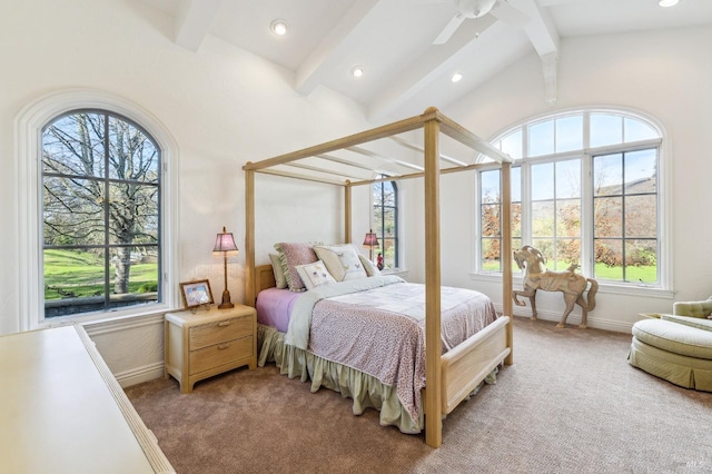 carpeted bedroom with lofted ceiling with beams and ceiling fan