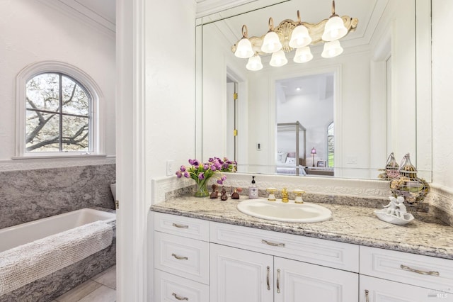 bathroom featuring a bath, vanity with extensive cabinet space, tile floors, and crown molding