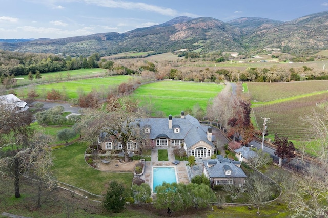 aerial view with a mountain view and a rural view