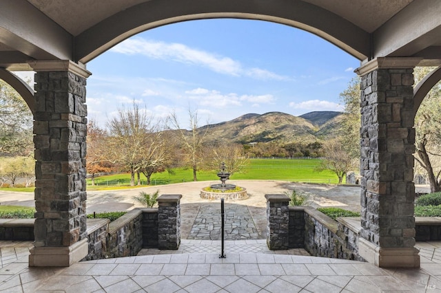 view of terrace featuring a mountain view