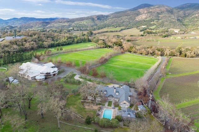 drone / aerial view featuring a mountain view and a rural view