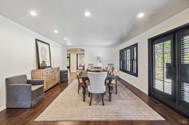 dining space with dark hardwood / wood-style floors