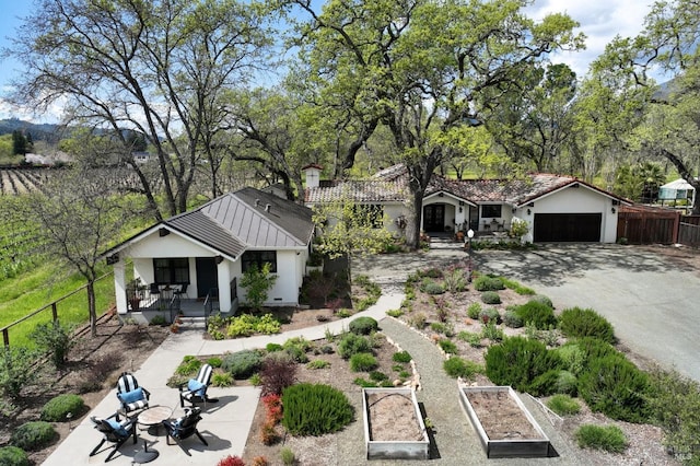 exterior space featuring a porch and a garage