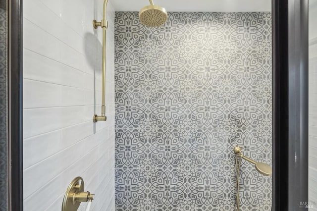 bathroom with tiled shower