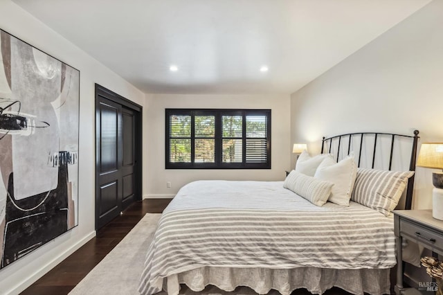 bedroom featuring dark hardwood / wood-style floors