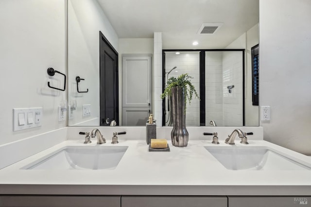 bathroom featuring vanity and a shower with shower door