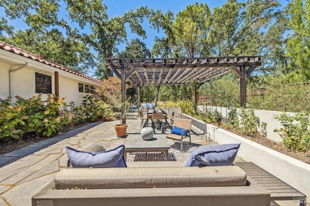 view of patio / terrace with an outdoor living space and a pergola