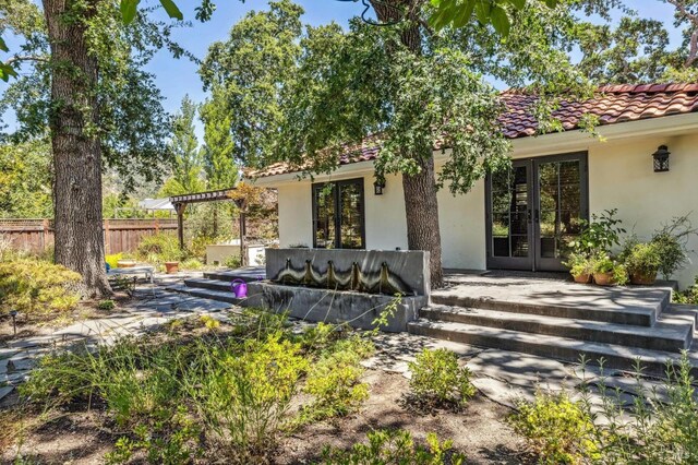 exterior space featuring french doors and a patio area